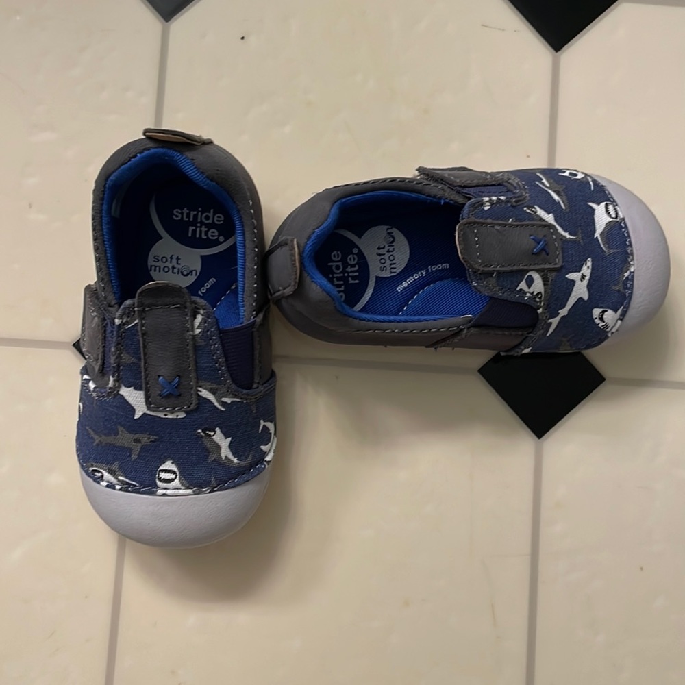 Stride rite soft motion slip on shoes. Navy with sharks. Never worn outside.